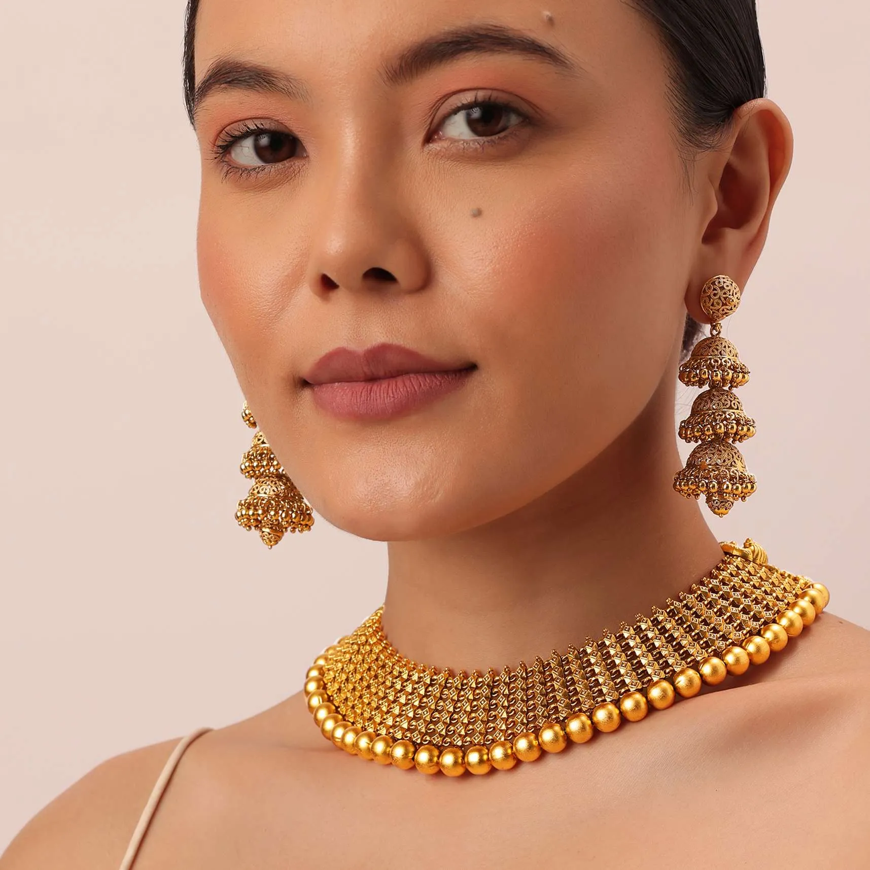 Gold Tone Temple Necklace With Layered Earrings